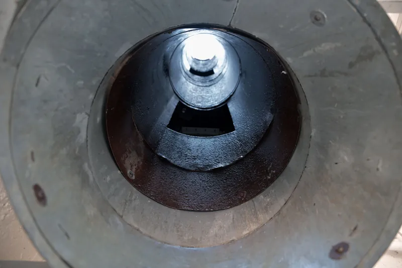 The same trash chute after cleaning, bare metal walls