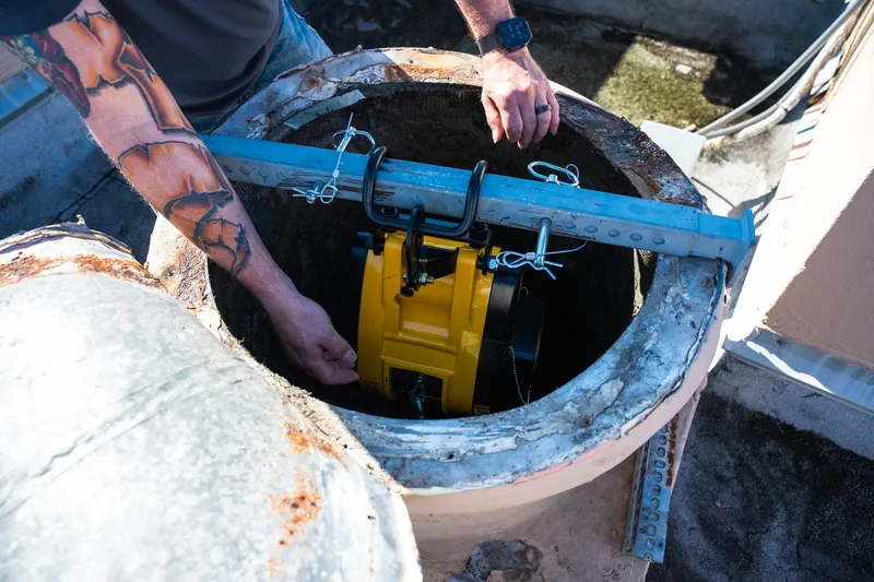 Chute cleaning equipment at the top of a trash chute