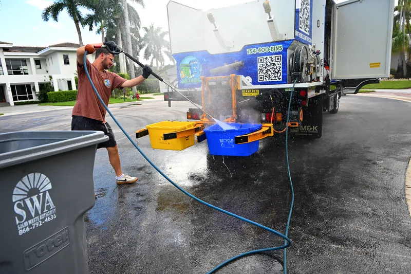 Crew pressure washing curbside at a home